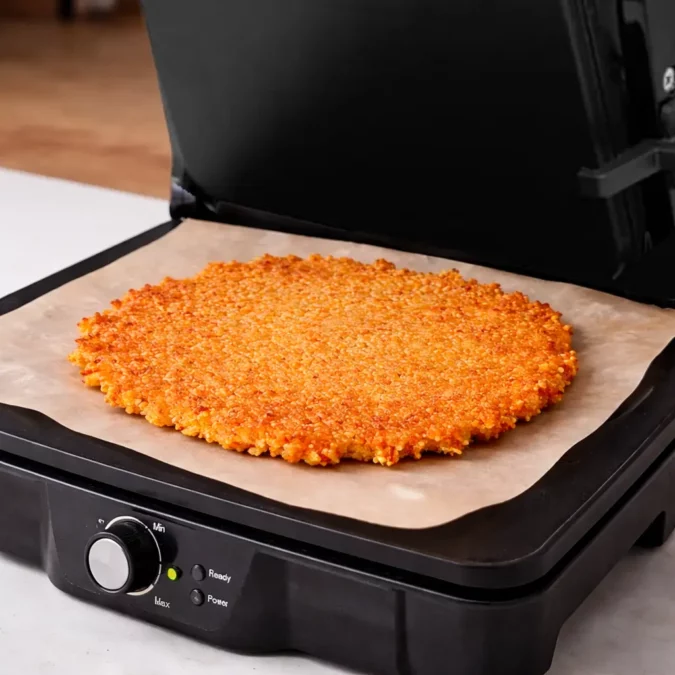Pressing rice in panini press for Giant Crispy Rice Cracker
